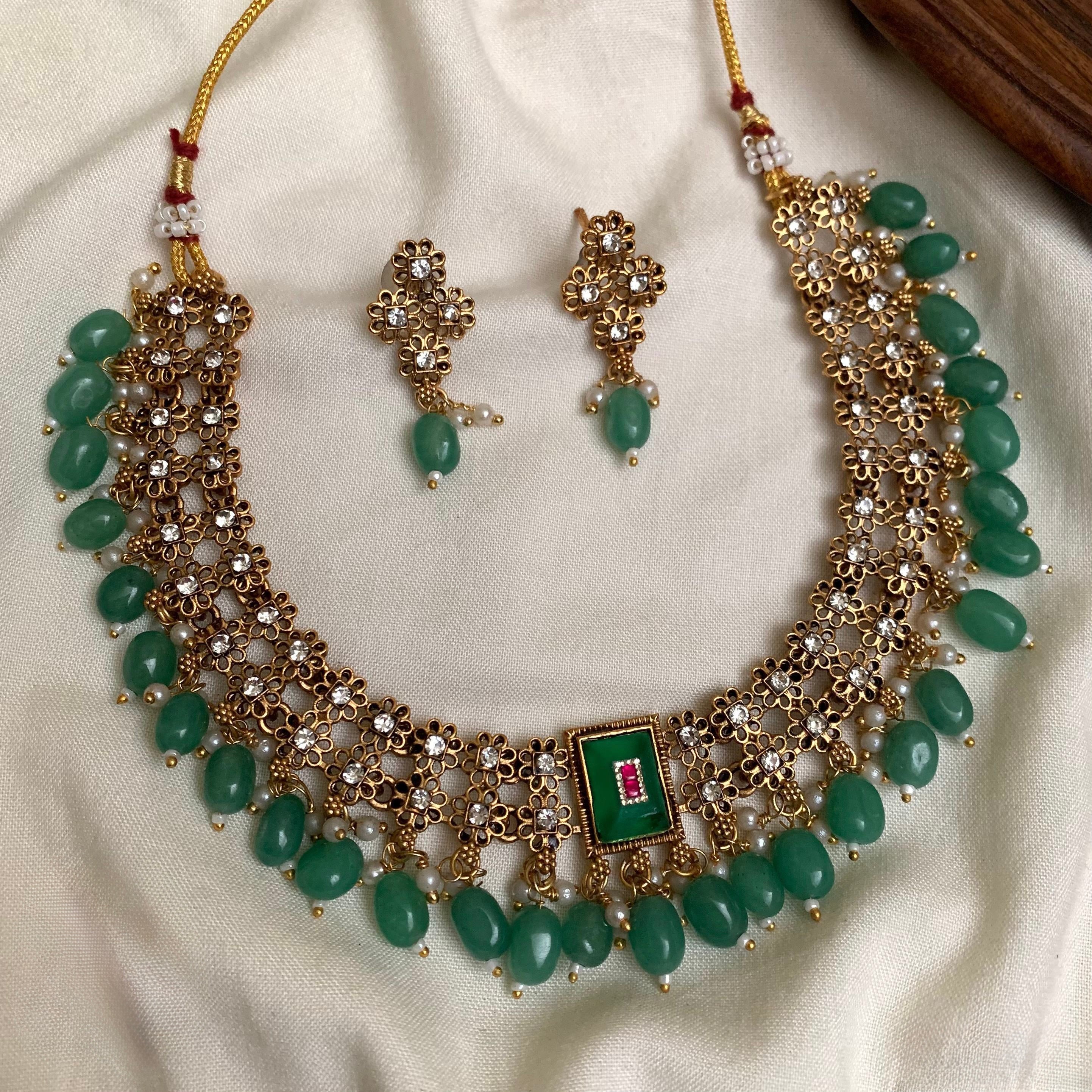 Golden Matte Finish Necklace Set with Mint Crystal